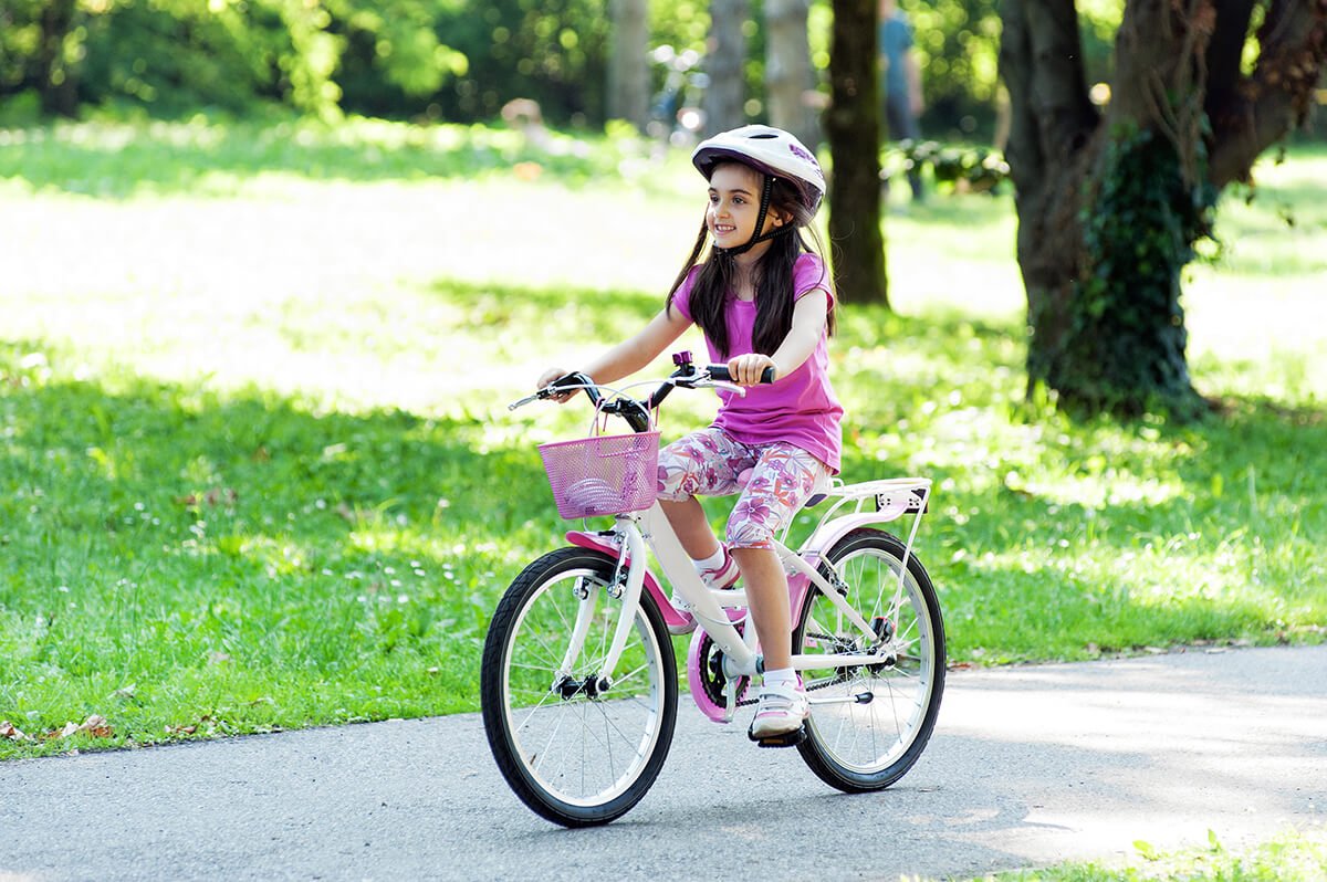 little girl riding on kids bike