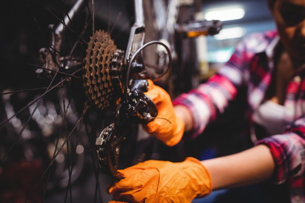 Unscrewing a screw to fix a bike chain