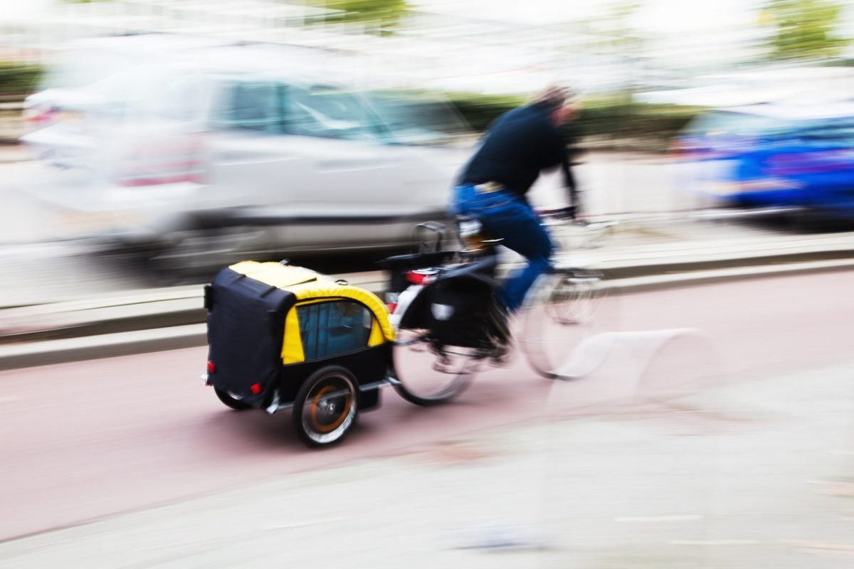 man with bike cargo trailer