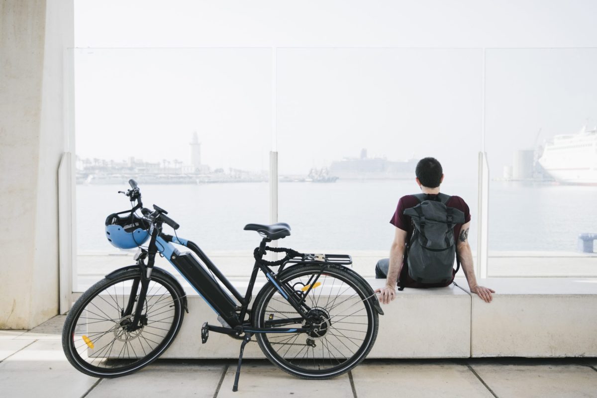 electric bike in front of man sitting