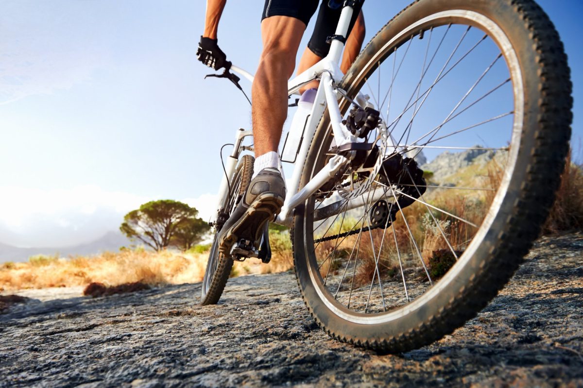 man close up on bike