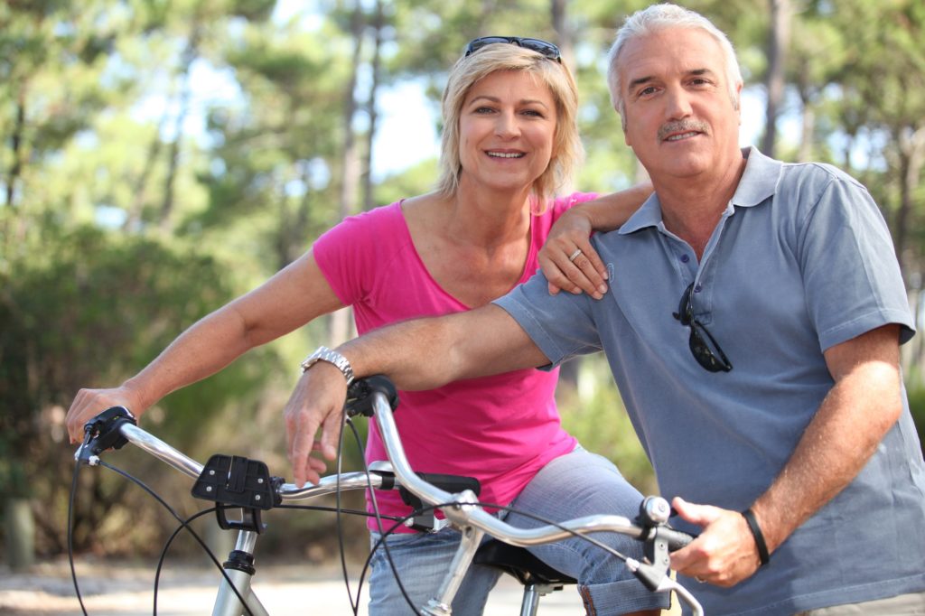 old couple on bikes
