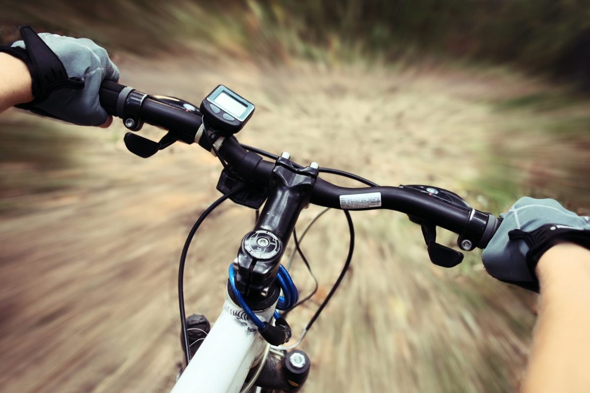 rider with gloves on bike