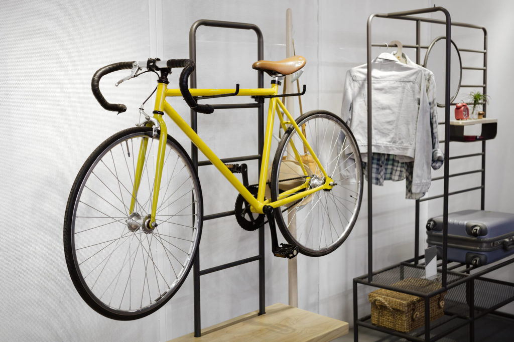 bike hanging on a shelf indoors